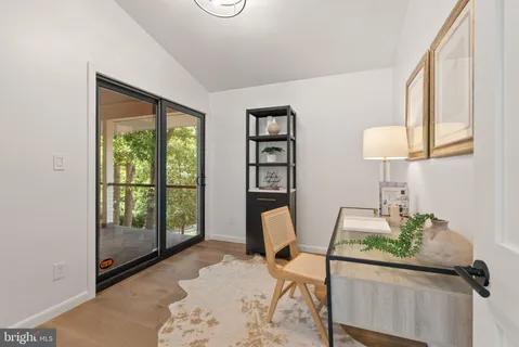 a very nice looking bedroom with a large bed and large windows