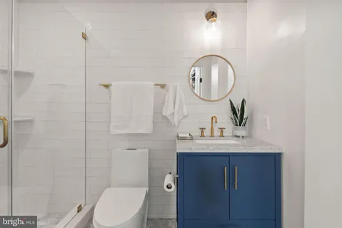 a view of a living room with hardwood floor and a large window