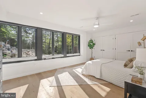 a bedroom with furniture and window