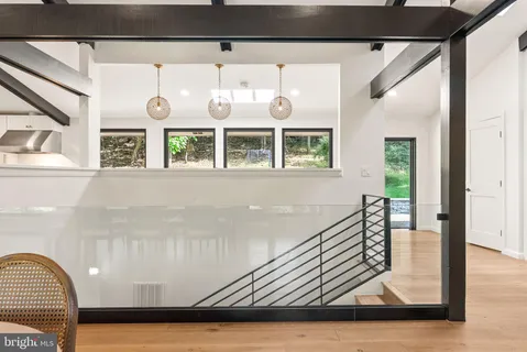 a kitchen with a table chairs stove and cabinets