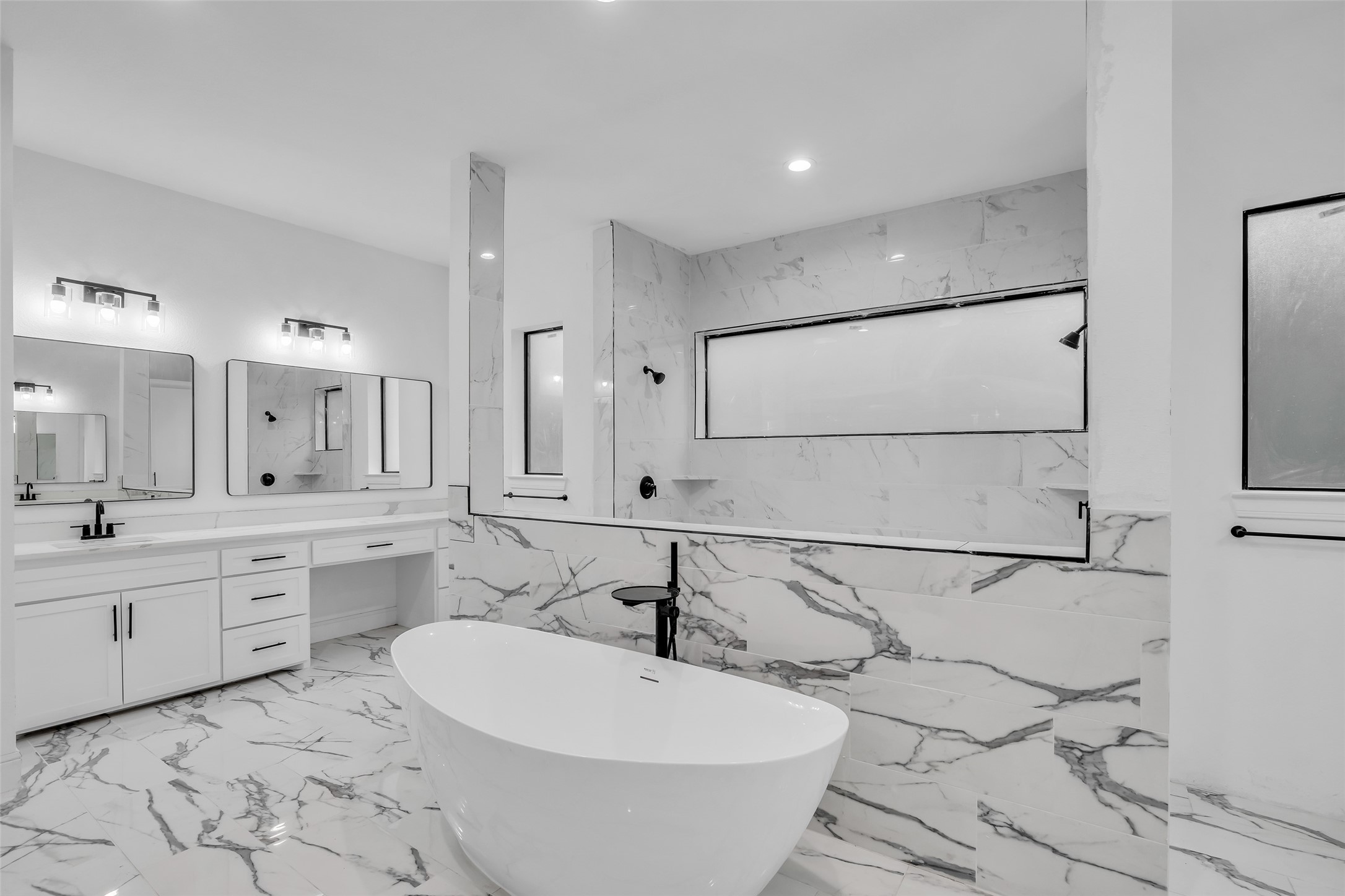 2 Deer Ridge Estates Boulevard Houston, TX 77339 - Photo 11 of 25 Luxurious primary bathroom featuring dual vanities, double toilets, and an expansive walk-in shower.
