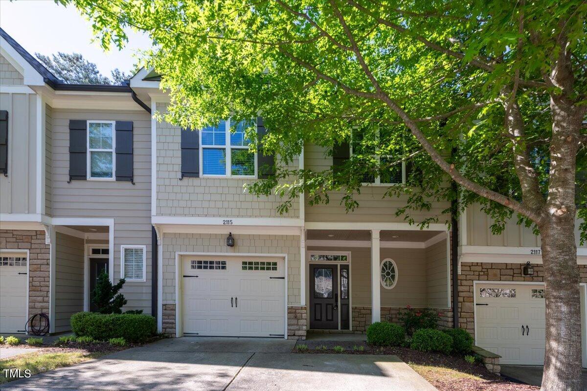2115 Scarlet Maple Drive Raleigh, NC 27606 - Photo 1 of 32 front view of house with a tree