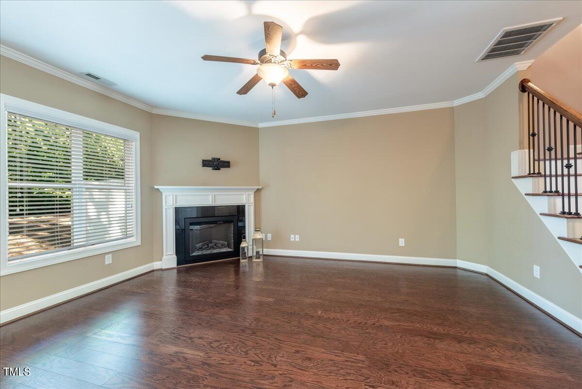2115 Scarlet Maple Drive Raleigh, NC 27606 - Photo 15 of 32 an empty room with windows fireplace and a sink