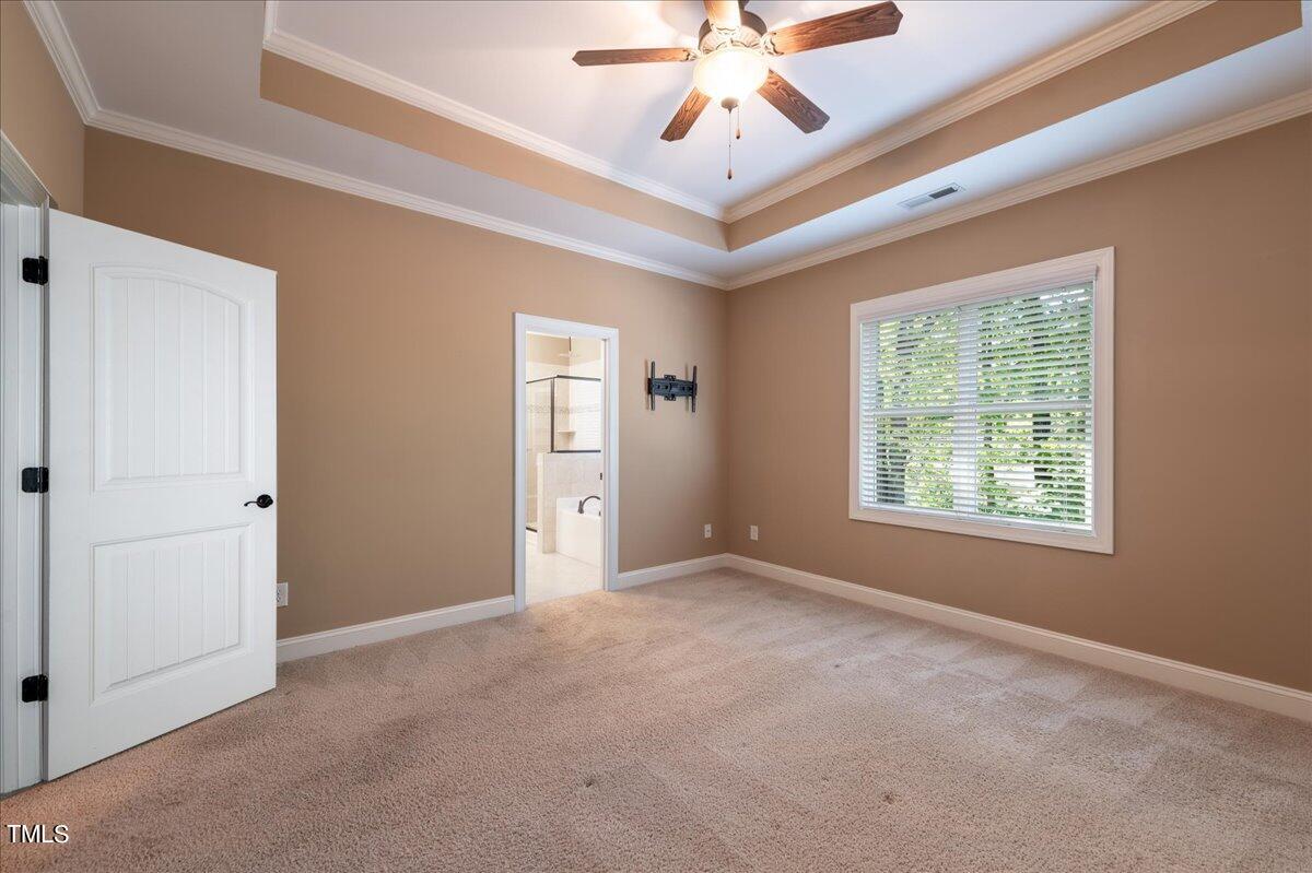 2115 Scarlet Maple Drive Raleigh, NC 27606 - Photo 18 of 32 a view of an empty room with a window