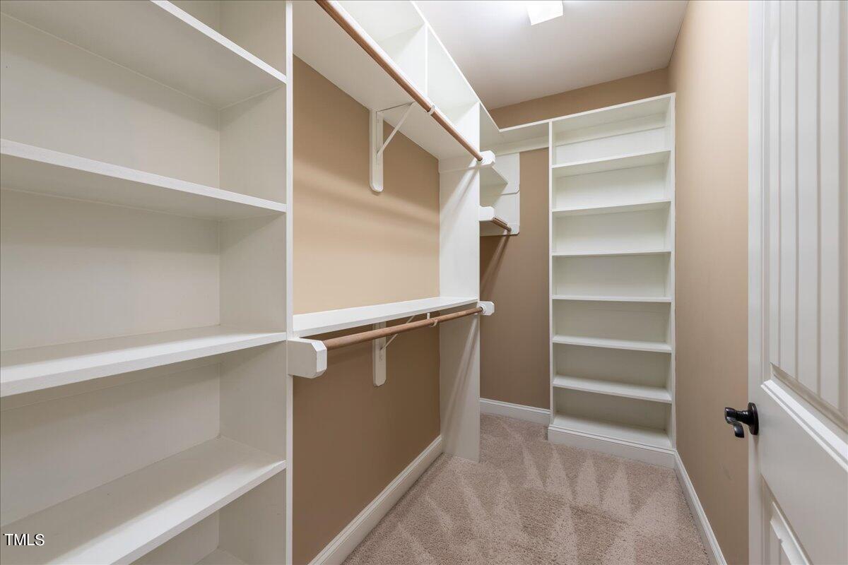 2115 Scarlet Maple Drive Raleigh, NC 27606 - Photo 20 of 32 a view of walk in closet with empty racks