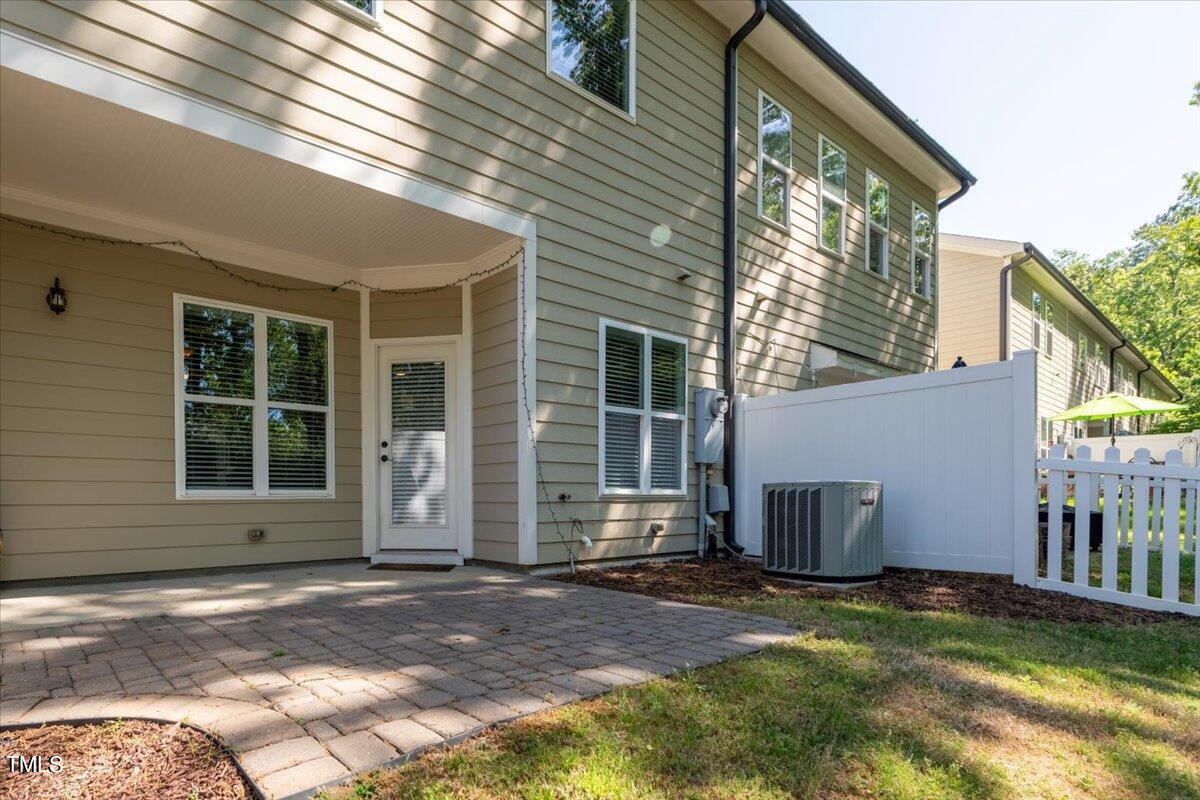 2115 Scarlet Maple Drive Raleigh, NC 27606 - Photo 32 of 32 a view of a house with backyard and garden