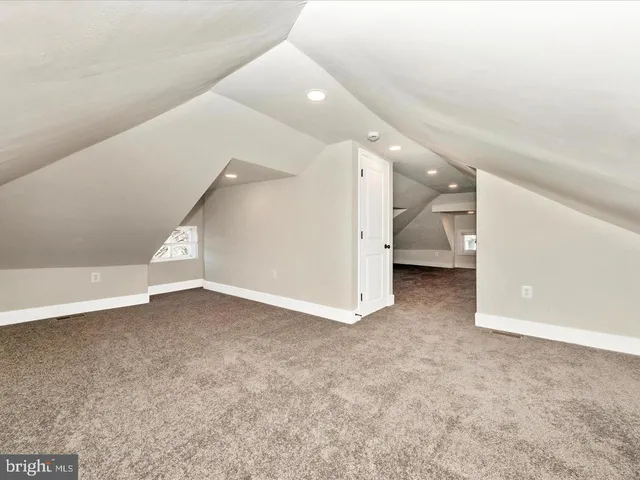 a view of an empty room and stairs