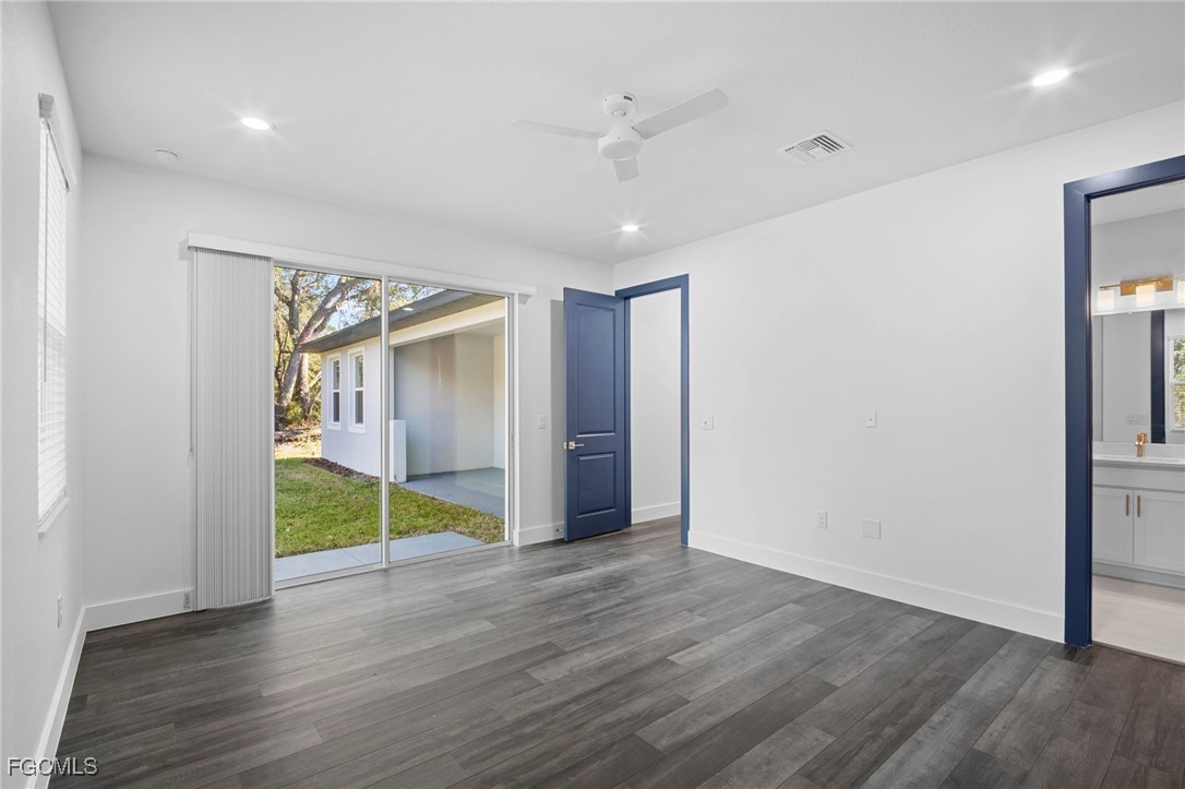 2816 Barry Road North Port, FL 34286 - Photo 15 of 36 a view of an empty room with wooden floor and closet