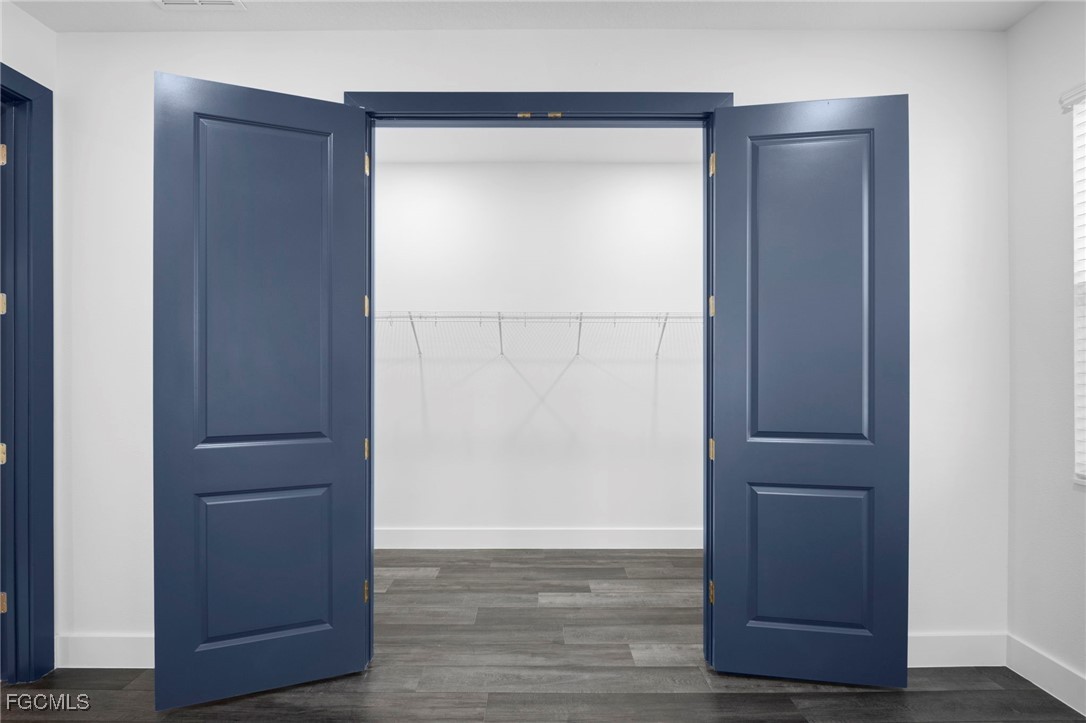 2816 Barry Road North Port, FL 34286 - Photo 16 of 36 an empty room with wooden floor and closet