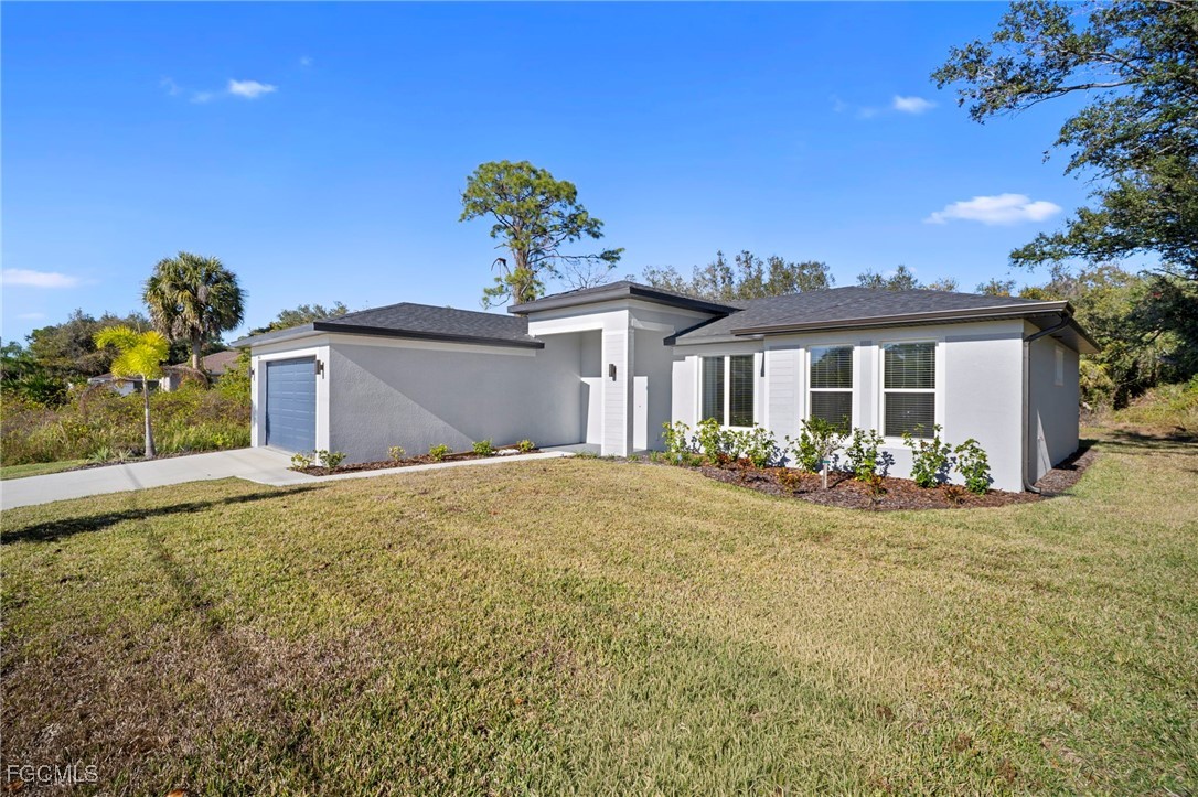 2816 Barry Road North Port, FL 34286 - Photo 2 of 36 a front view of a house with a yard