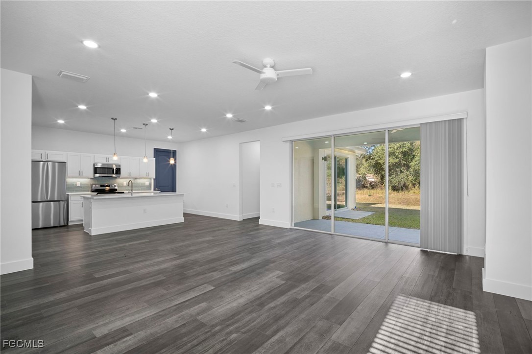 2816 Barry Road North Port, FL 34286 - Photo 22 of 36 a view of kitchen with cabinets and wooden floor
