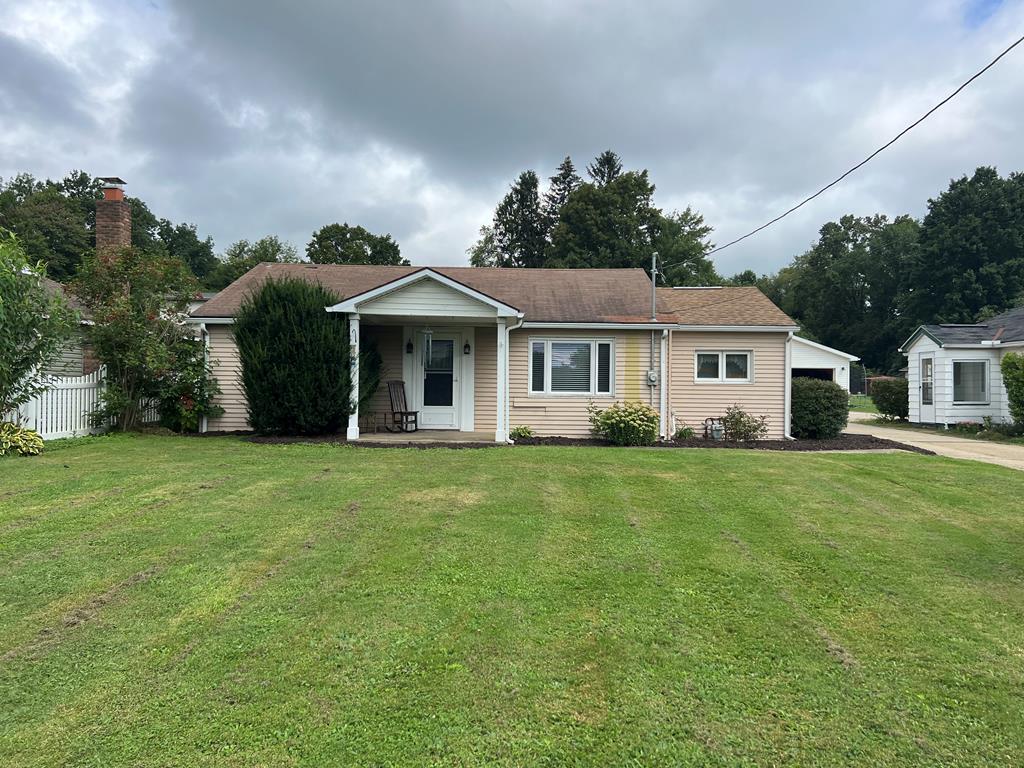 1169 Mercer Road Franklin, PA 16323 - Photo 1 of 29 a front view of a house with a garden