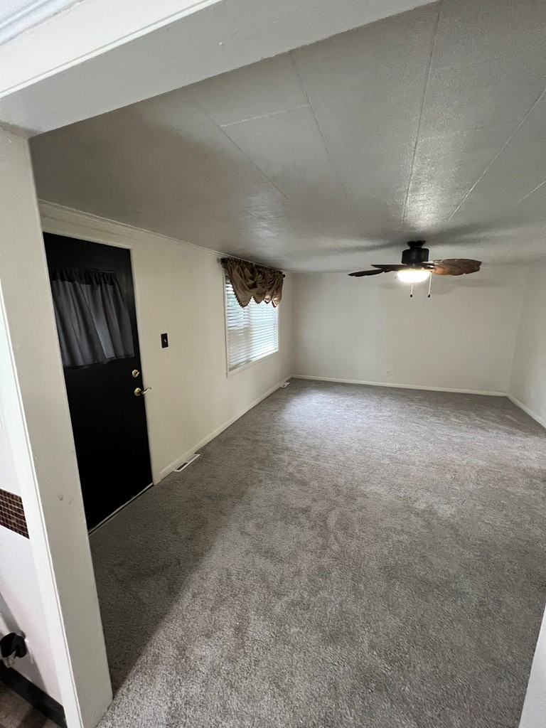 1169 Mercer Road Franklin, PA 16323 - Photo 14 of 29 an empty room with windows and entrance