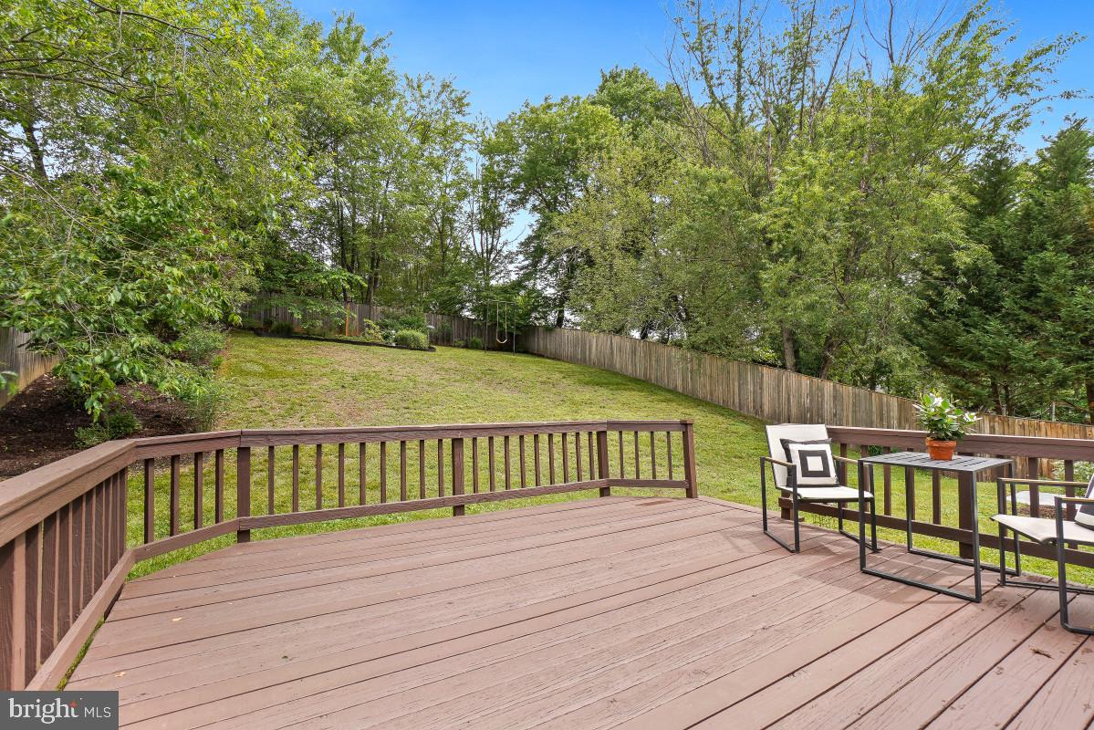 827 Caddington Avenue Silver Spring, MD 20901 - Photo 38 of 45 a view of a deck with wooden floor and fence