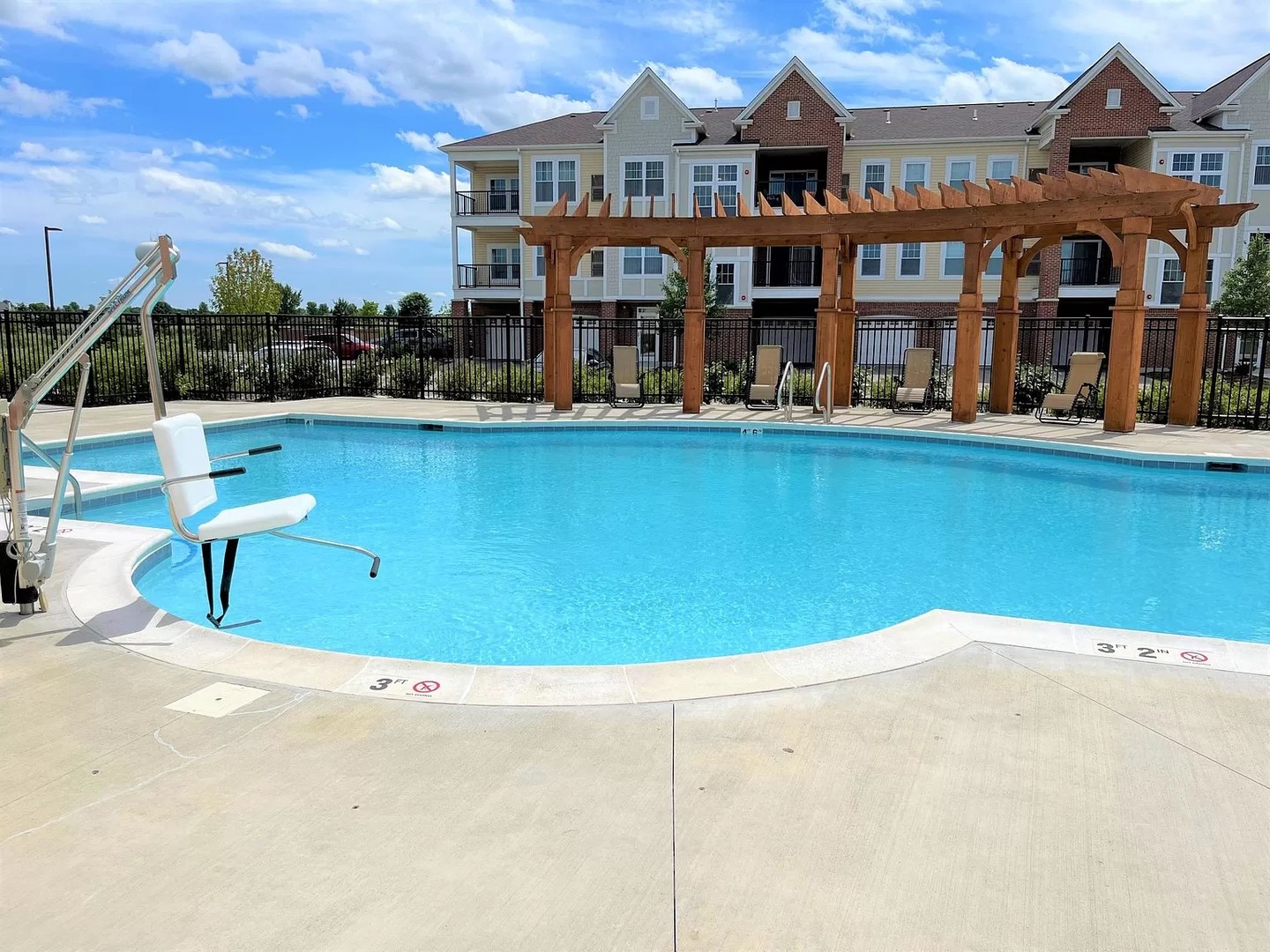 12834 South White Willow Drive, Unit 207 Plainfield, IL 60585 - Photo 4 of 11 a front view of a house with swimming pool