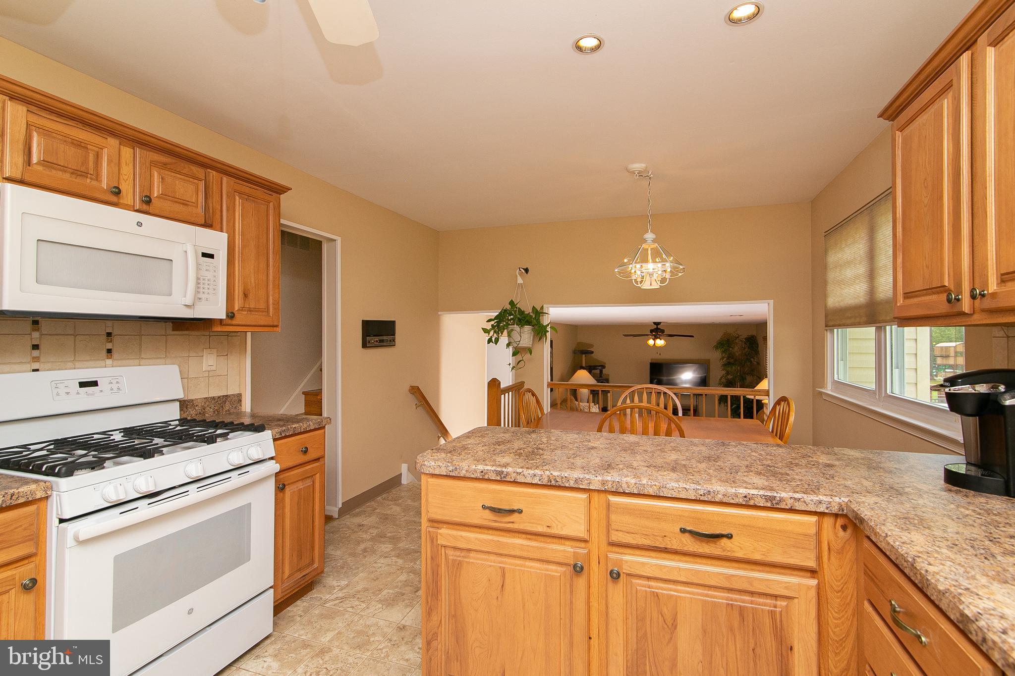 51 Rotterdam Road West Holland, PA 18966 - Photo 13 of 53 a kitchen with granite countertop stainless steel appliances a sink stove and cabinets