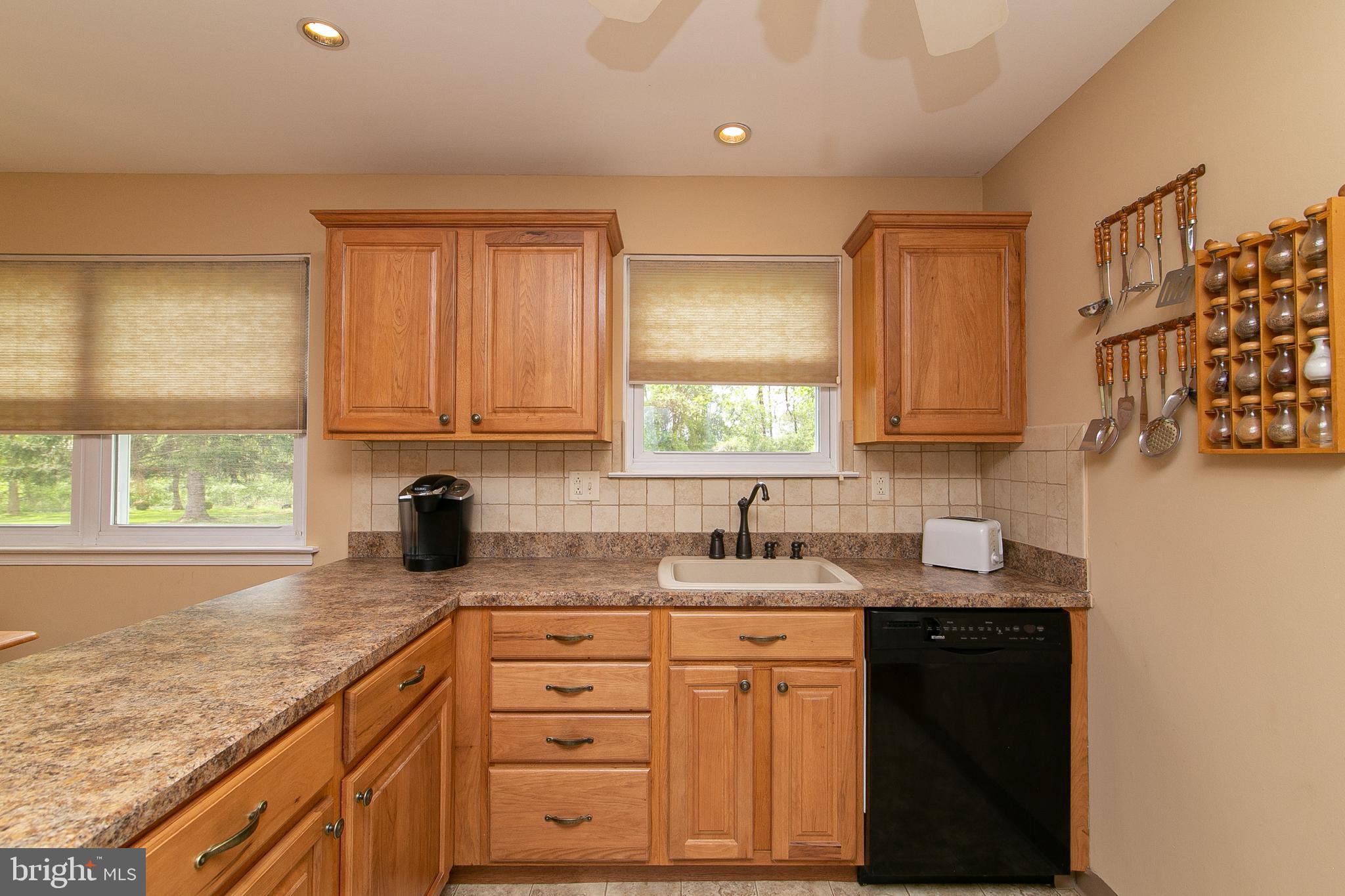 51 Rotterdam Road West Holland, PA 18966 - Photo 14 of 53 a kitchen with granite countertop a sink window and cabinets