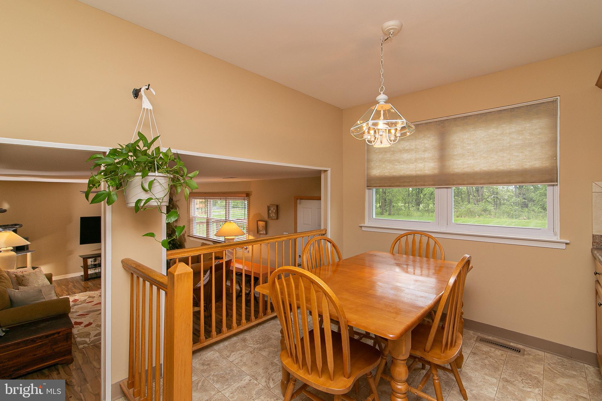 51 Rotterdam Road West Holland, PA 18966 - Photo 15 of 53 a dining room with furniture potted plants and wooden floor