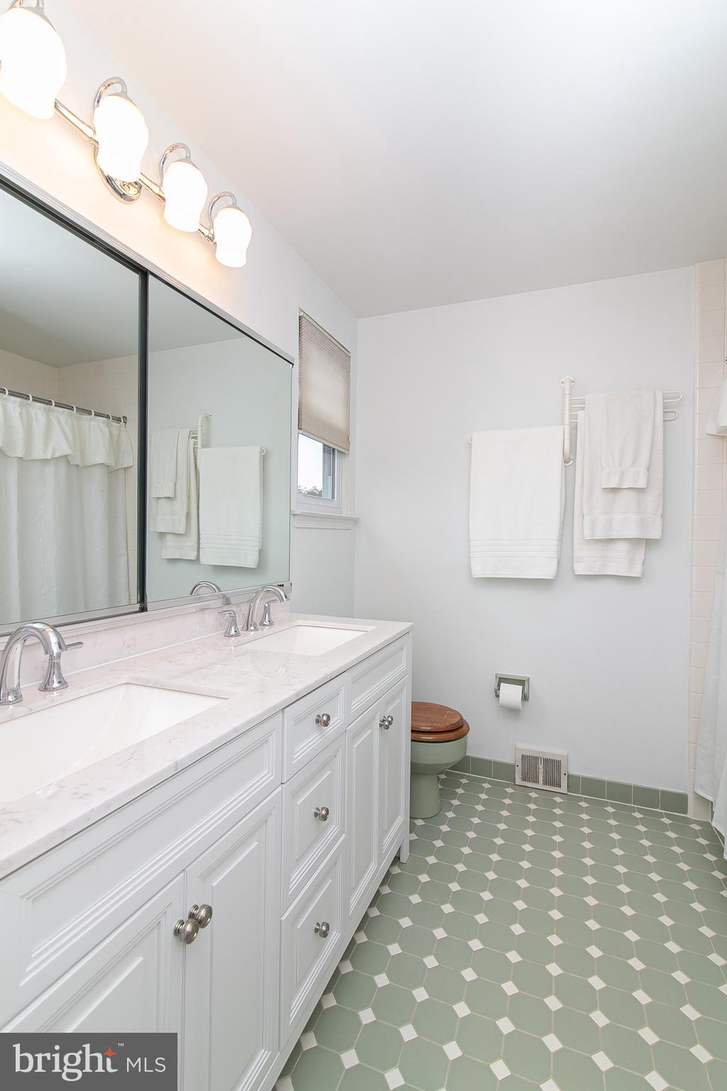 51 Rotterdam Road West Holland, PA 18966 - Photo 39 of 53 a bathroom with a sink a toilet and mirror