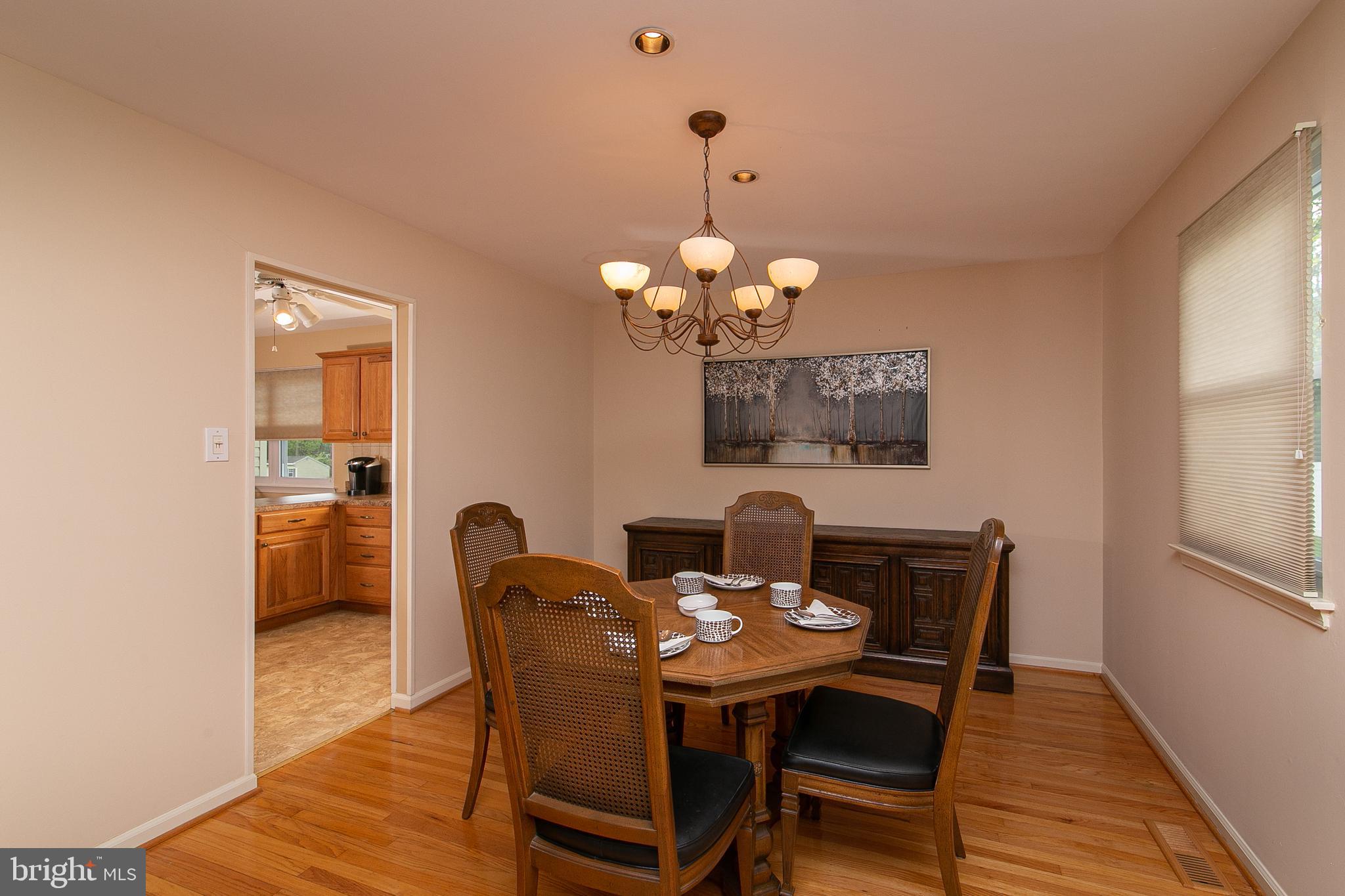 51 Rotterdam Road West Holland, PA 18966 - Photo 7 of 53 a dining room with furniture a chandelier and wooden floor