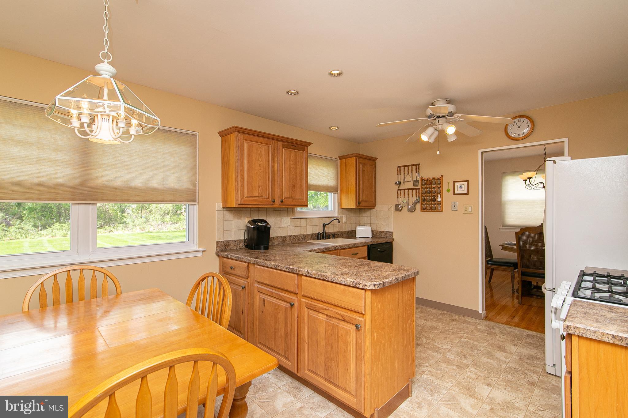 51 Rotterdam Road West Holland, PA 18966 - Photo 10 of 53 a kitchen with stainless steel appliances granite countertop a sink a stove cabinets counter space and a window
