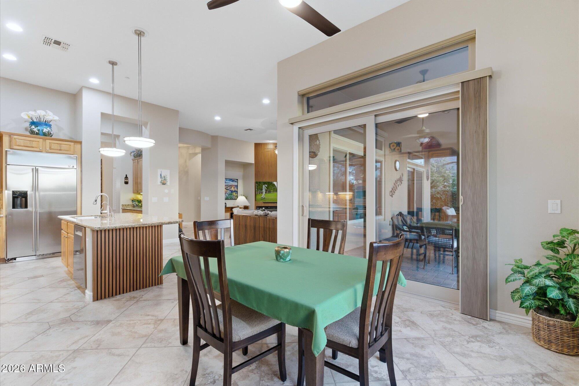 40322 North Hawk Ridge Trail Anthem, AZ 85086 - Photo 14 of 63 a view of a dining room with furniture
