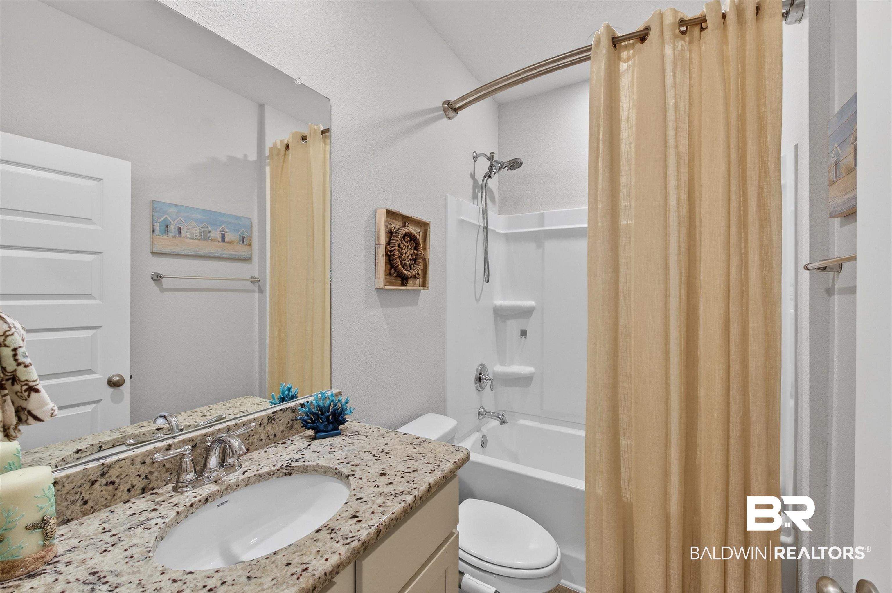 8735 Bronze Lane Foley, AL 36535 - Photo 35 of 58 Bathroom vanity featuring a granite countertop with an undermount sink and chrome faucet
