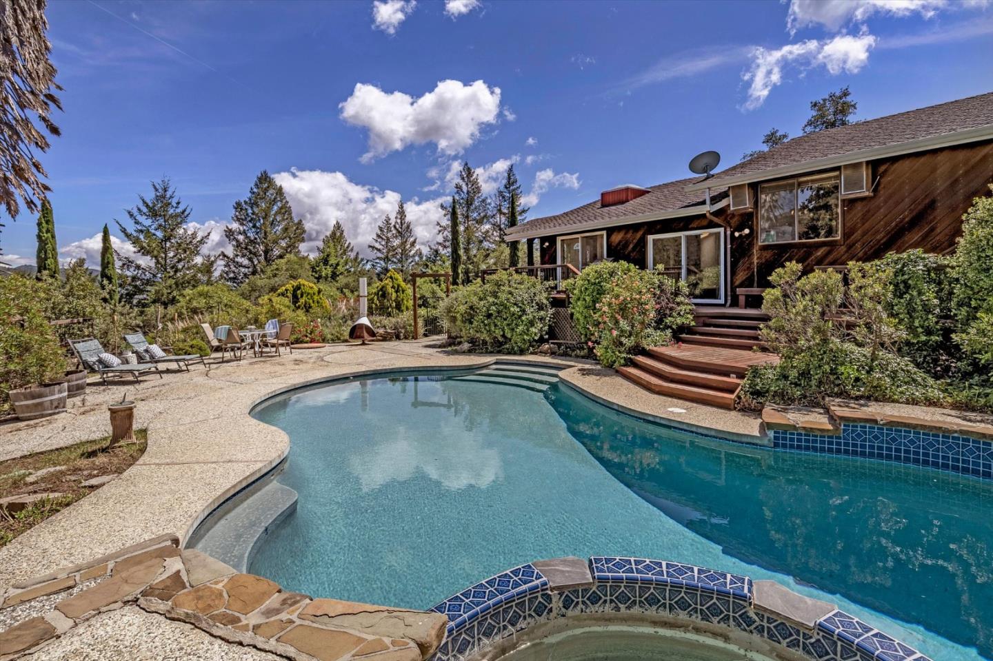 25149 Radonich Road Los Gatos, CA 95033 - Photo 3 of 47 a swimming pool with outdoor seating and yard
