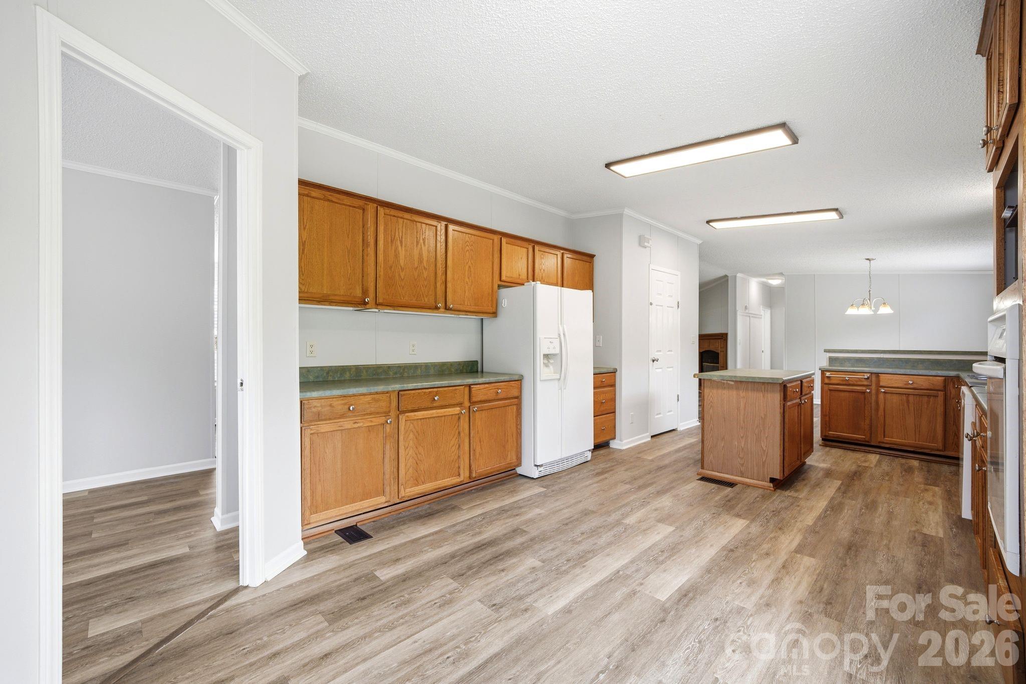 2368 Beth Haven Church Road Denver, NC 28037 - Photo 22 of 42 a kitchen with a sink and refrigerator