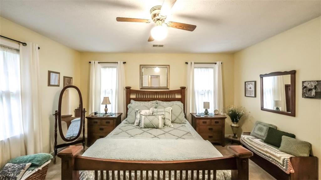 712 Honeysuckle Lane Temple, GA 30179 - Photo 17 of 46 a bed room with a bed and furniture