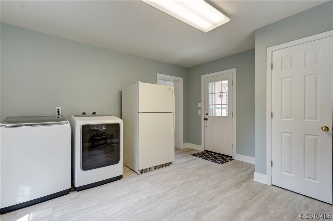 3421 Kenmore Road Richmond, VA 23225 - Photo 23 of 41 a view of a kitchen with a sink refrigerator and window