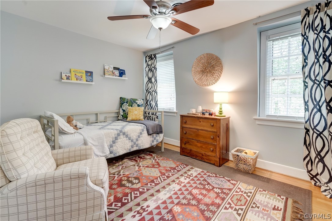 3421 Kenmore Road Richmond, VA 23225 - Photo 30 of 41 a bedroom with a bed and a chandelier