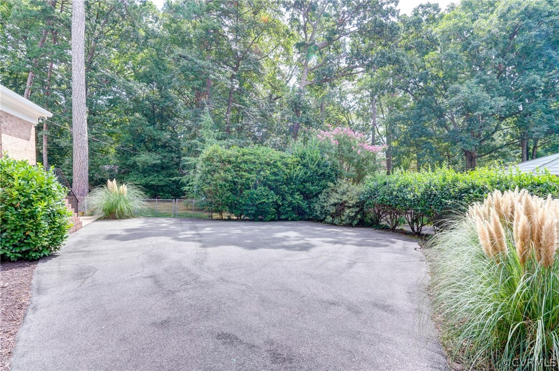 3421 Kenmore Road Richmond, VA 23225 - Photo 38 of 41 a view of a field with plants and trees