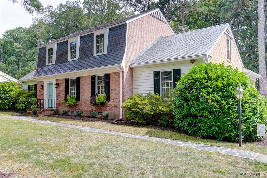 3421 Kenmore Road Richmond, VA 23225 - Photo 4 of 41 a front view of a house with a garden