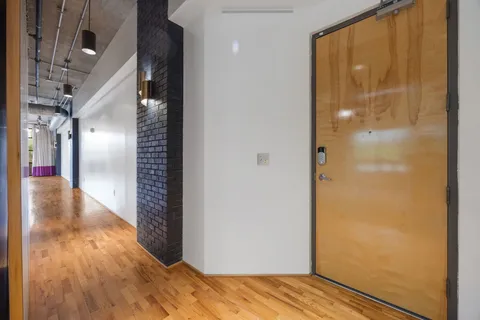 a view of gallery with wooden floor