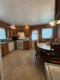 1236 Fisher Street Munster, IN 46321 - Photo 11 of 29 a kitchen with a table chairs microwave and cabinets
