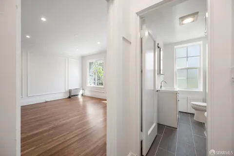 a bathroom with a bathtub and a toilet
