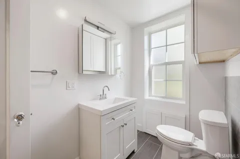 a kitchen with stainless steel appliances granite countertop a stove a refrigerator and a sink