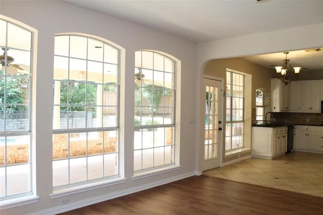 a view of an entryway with wooden floor