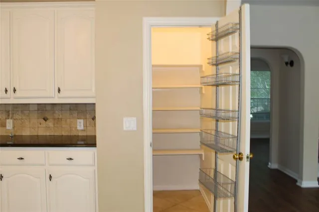 a view of a kitchen with wooden floor