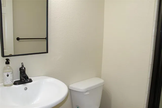 a bathroom with a shower and a toilet