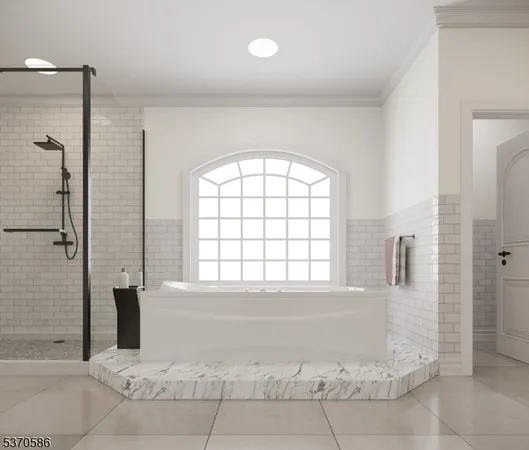 a bedroom with a large bed a couch and dresser