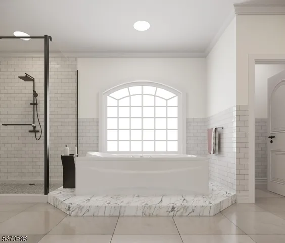 a bedroom with a large bed a couch and dresser