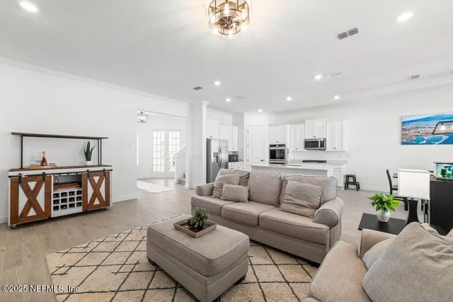 a bedroom with a large bed and a tv