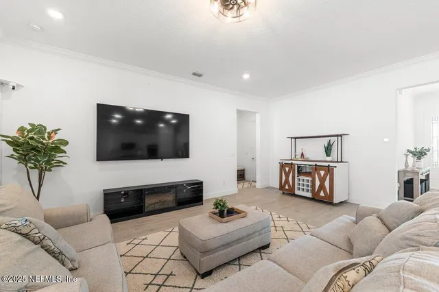 a spacious bathroom with double sink and a mirror