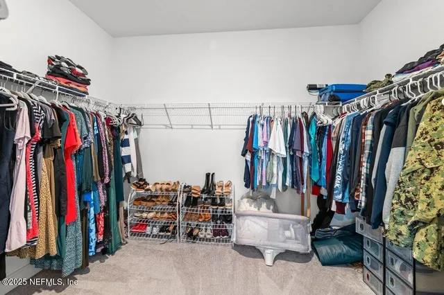 a aerial view of a balcony with chairs and umbrellas