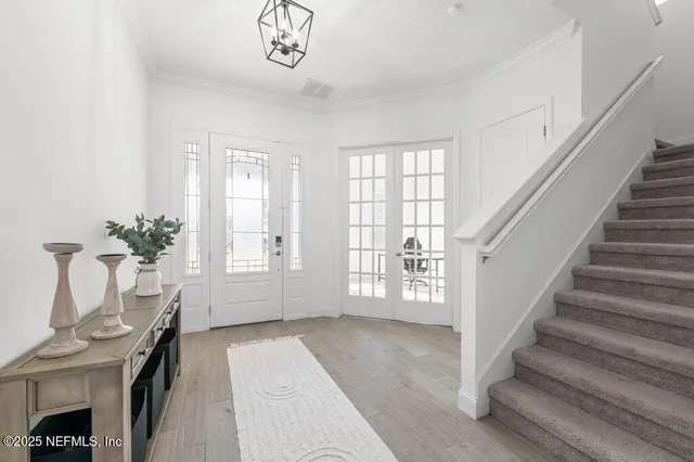 a kitchen with stainless steel appliances a refrigerator stove microwave and sink