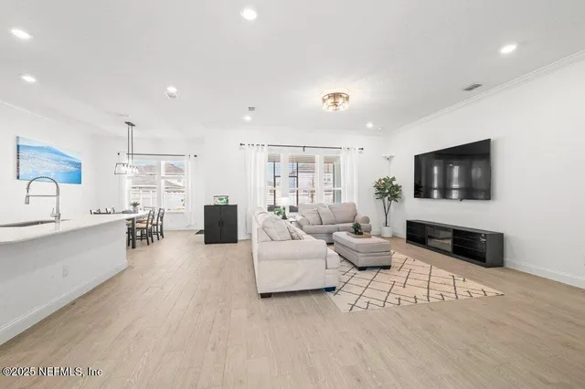 a living room with furniture and a table