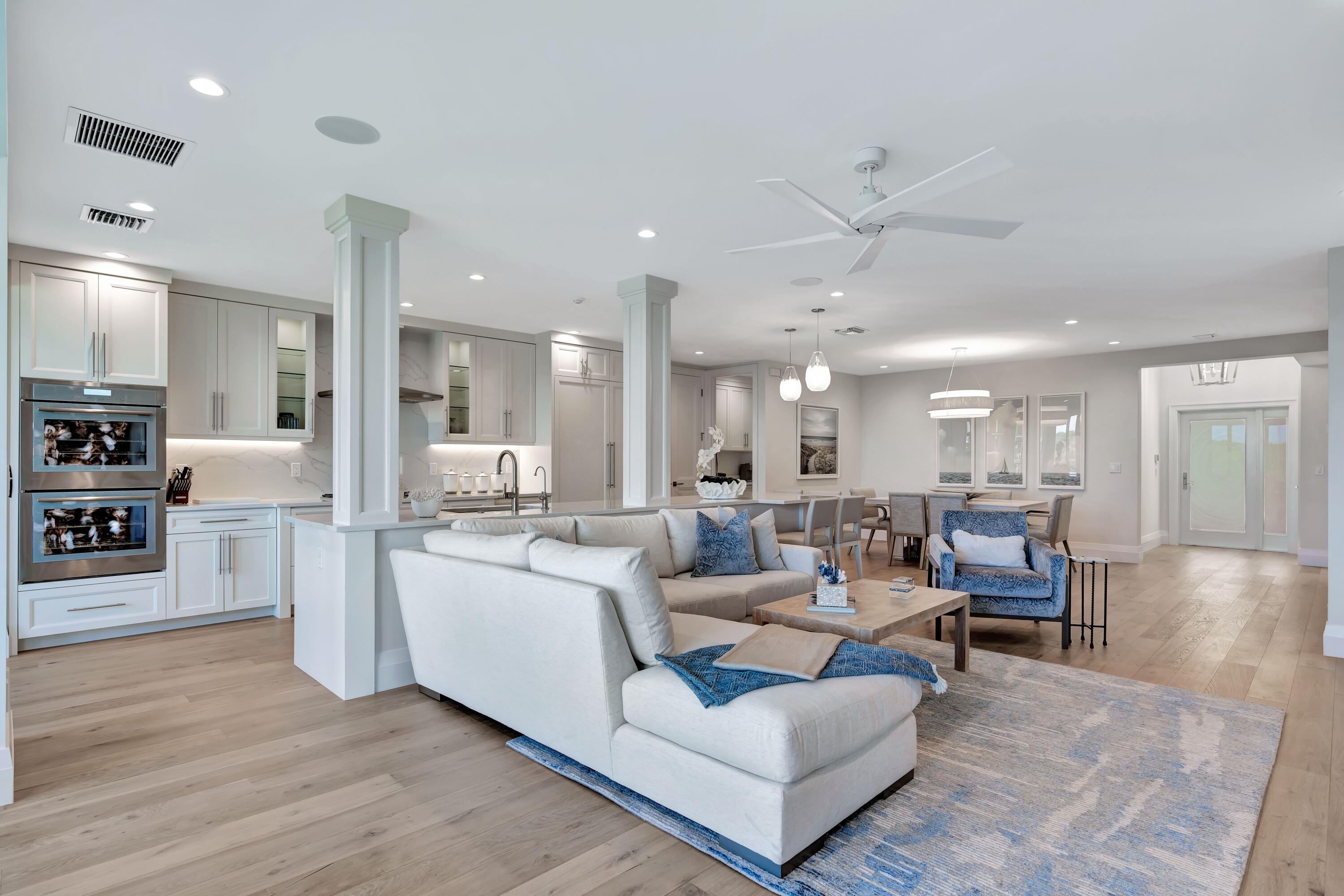260 Eagle Drive Jupiter, FL 33477 - Photo 12 of 41 a living room with furniture and a wooden floor