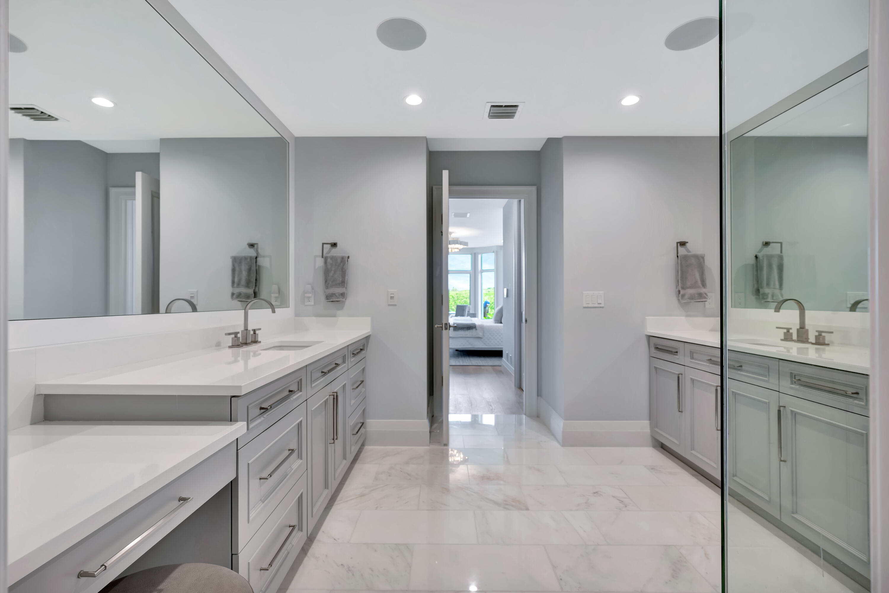 260 Eagle Drive Jupiter, FL 33477 - Photo 27 of 41 a spacious bathroom with a granite countertop sink a toilet a mirror and shower